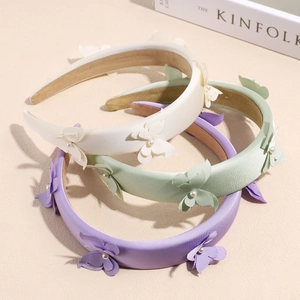 Three padded satin headbands in pastel colors with 3D fabric butterflies and faux pearls