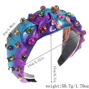 Detail view of a padded knot headband with colorful rhinestones and purple gradient fabric