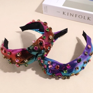 Luxurious padded knotted headband with rhinestones and pearlescent fabric texture