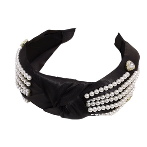 Fashionable black knotted headband with white pearls and sparkling crystal accents