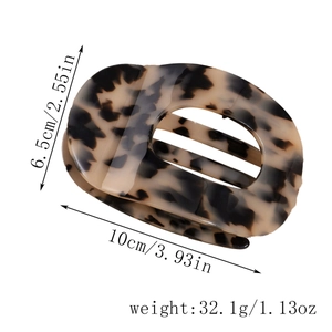 Detail view of large leopard print hair claw clip with size dimensions 10cm by 6.5cm