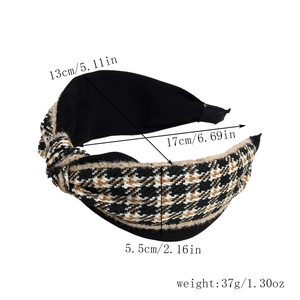 Detail view showing dimensions of a wide knotted headband with houndstooth pattern fabric