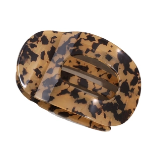 Leopard print acetate hair claw clip with large oval cutout design and glossy finish