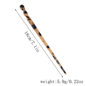 Detailed view of tortoise shell acetate hair stick showing 18cm length and weight