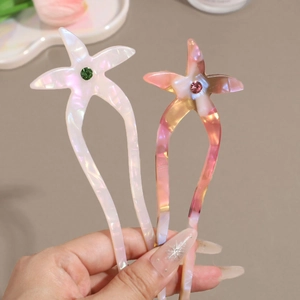 Starfish acetate hair pin set with sparkling rhinestones in iridescent finish
