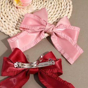 Elegante Haarklammern mit Schleife und Rüschenrand in Rosa und Weinrot mit Metallfederclip