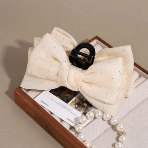 Elegant beige mesh bow hair claw clip with silver sequins and black shark clip for women