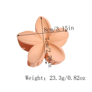 Detailed view of lily flower hair claw with 8cm dimensions and frosted peach finish