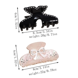 Detailed size view of rhinestone-studded hair claws in black fish-tail and pink bow designs