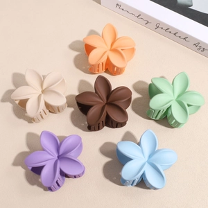 Matte floral hair claws in six colors including orange and blue for elegant styling