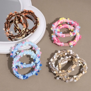 Set of colorful pom-pom elastic hair ties for women, featuring soft plush balls and high stretch