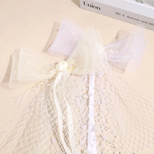 Elegant bridal hair clip featuring mesh bow, faux pearls and decorative rose flower