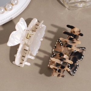 Elegant butterfly hair claws with pearls and rhinestones in white and tortoise shell