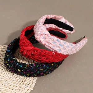 Three stylish sequin knotted headbands in pink, red, and black with high top design