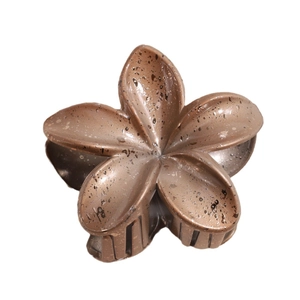 Elegant lily flower hair claw clip with a bronze speckled matte finish for women