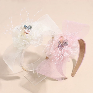 Elegant beige and pink mesh flower headband with pearls and bow for luxury hair styling