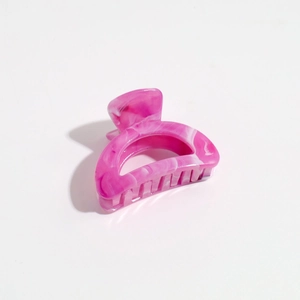 Close-up of pink marble pattern on a semicircular hair claw clip for women