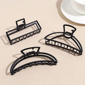 Set of three matte black metal geometric hair claws for elegant bun hairstyles