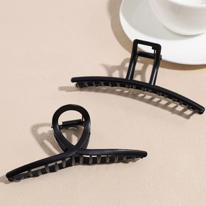 Set of two minimalist matte black geometric hair claws with strong metal spring for styling