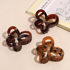 Three-piece butterfly hair claw clip set with leopard print and matte tortoiseshell finish