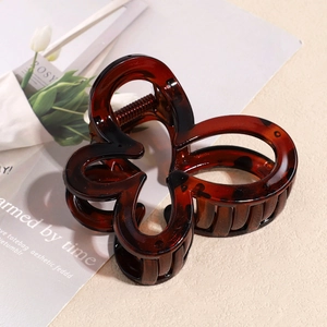 Large amber leopard print claw clip with hollow butterfly design for women hair