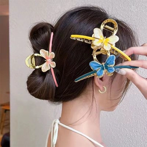 Three elegant butterfly hair claws in pink, yellow, and blue colors for women's hairstyle