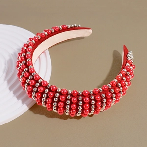Detail of red padded headband with hand-sewn red pearls and silver faceted beads
