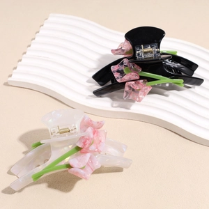 Luxurious tulip shark hair clips in glossy black and pearl white with 3D marble petals