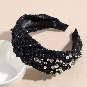 Detail of tweed headband with pearls and crystals showing rich texture and knot design