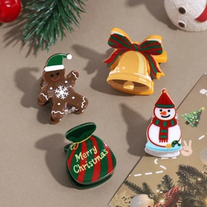Christmas hair clips set featuring gingerbread man, snowman, bell, and gift bag designs
