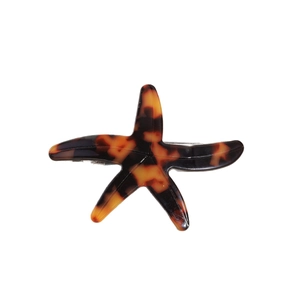 Starfish shaped acetate hair clip with vintage tortoiseshell pattern and metal back clip