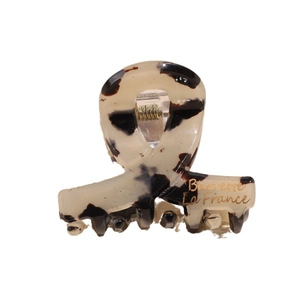 Molletta per capelli minimalista in acetato leopardato con scritte dorate su sfondo bianco