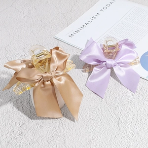 Pinces à cheveux élégantes avec nœud en satin, couleurs doré champagne et lilas