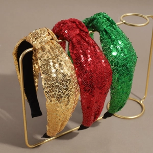 Sparkly sequin knotted headbands in gold, red, and green for Christmas party fashion