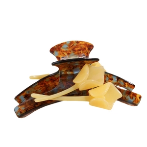 Luxurious tulip hair claw clip with blue tortoiseshell pattern and 3D yellow flowers