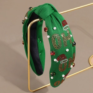 Grüner Weihnachts-Knoten-Haarreif mit Strass, Perlen und Schmucksteinen auf Goldständer