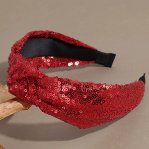 Detail of red sequin knotted headband with premium high-density reflective texture