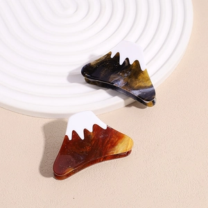 Minimalist Mount Fuji hair claws with marble texture and white snow-capped peaks