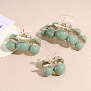 Three-piece bean green hair claw set with round pearl-like beads in various sizes