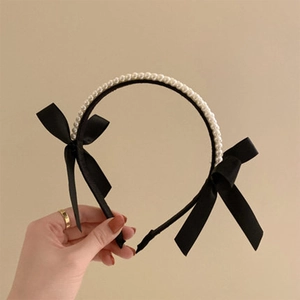 Elegant vintage black bow and pearl headband for women with classic white pearls and ribbon