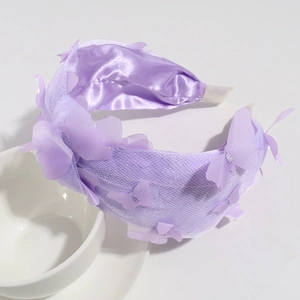 Detail of purple mesh butterfly headband showing multi-layered 3D fabric embellishments