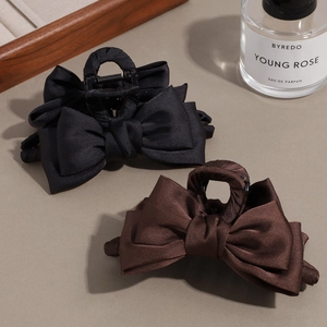 Elegant satin bow claw clip set in black and dark brown with premium textured finish
