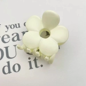 Creamy white matte flower hair claw clip with minimalist hollow five-petal design