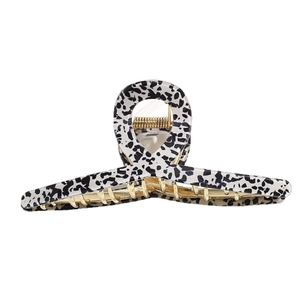 Large leopard print hair claw clip with black white spots and golden metal spring
