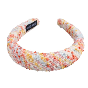 Colorful mixed tweed plush headband with thick padded design and hand made woven label