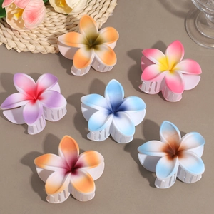 Matte gradient plumeria flower hair claws in multiple colors for summer beach hair styles