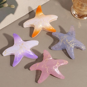 Pinces à cheveux étoile de mer avec dégradé orange et rose et marbrure dorée