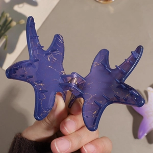 Pince à cheveux étoile de mer dégradée violet foncé avec texture marbrée dorée
