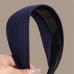 Navy blue wide ribbed knit headband with anti-slip inner teeth for high skull top look