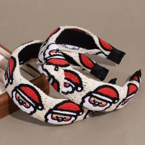 Set di due cerchietti natalizi in maglia con motivi di Babbo Natale ricamati